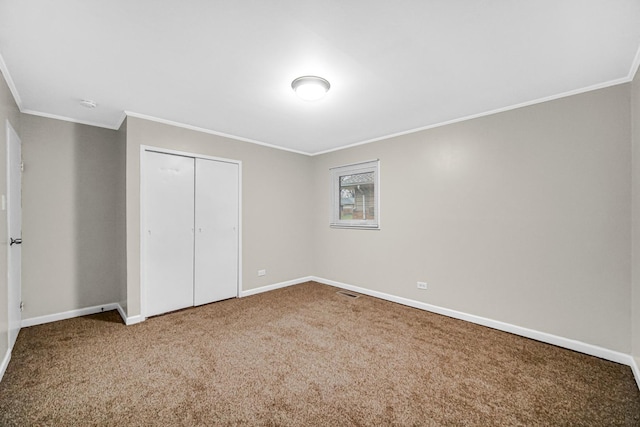 172 Nanti St, Park Forest, IL 60466 - unfurnished bedroom featuring crown molding, baseboards, carpet floors, and a closet