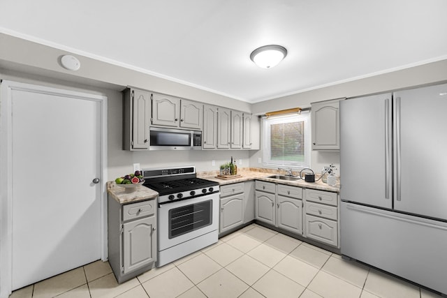 172 Nanti St, Park Forest, IL 60466 - kitchen with appliances with stainless steel finishes, gray cabinetry, a sink, light countertops, and light tile patterned flooring
