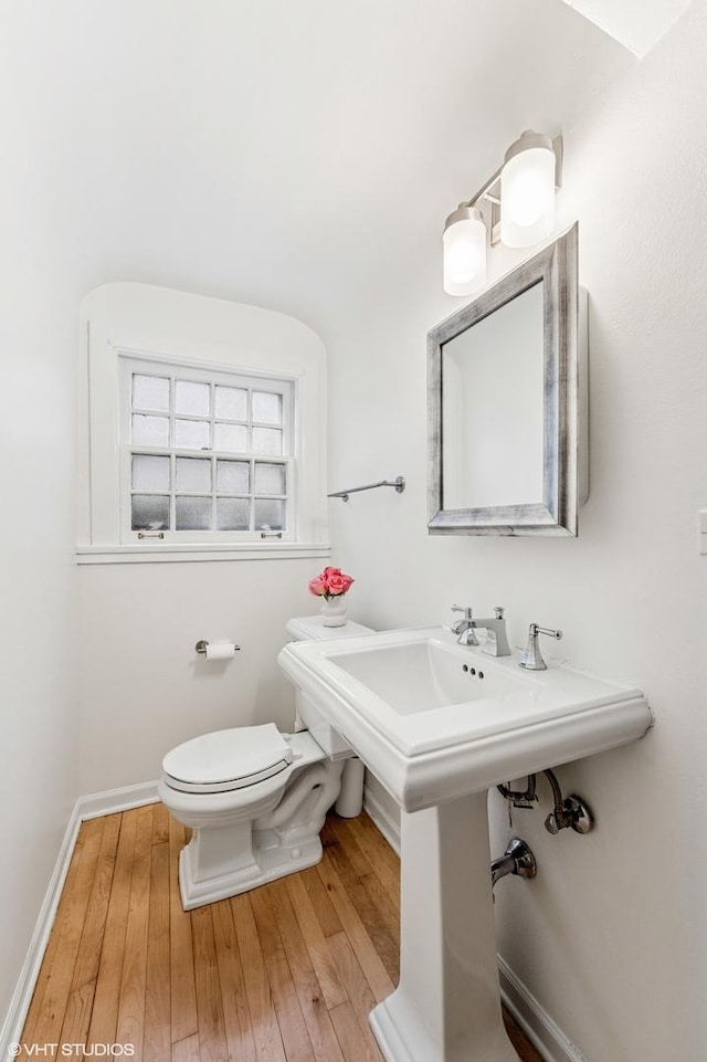 350 Elder Ln, Winnetka, IL 60093 - half bath with hardwood / wood-style floors, toilet, and baseboards