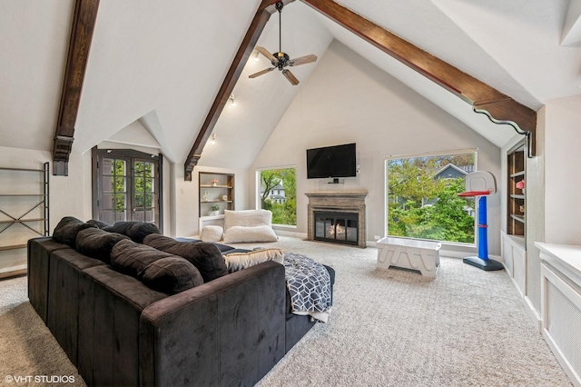 350 Elder Ln, Winnetka, IL 60093 - carpeted living area featuring high vaulted ceiling, beamed ceiling, built in shelves, a glass covered fireplace, and ceiling fan
