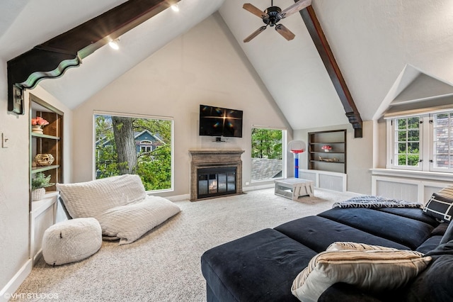 350 Elder Ln, Winnetka, IL 60093 - carpeted living area featuring high vaulted ceiling, a fireplace with flush hearth, ceiling fan, beam ceiling, and baseboards