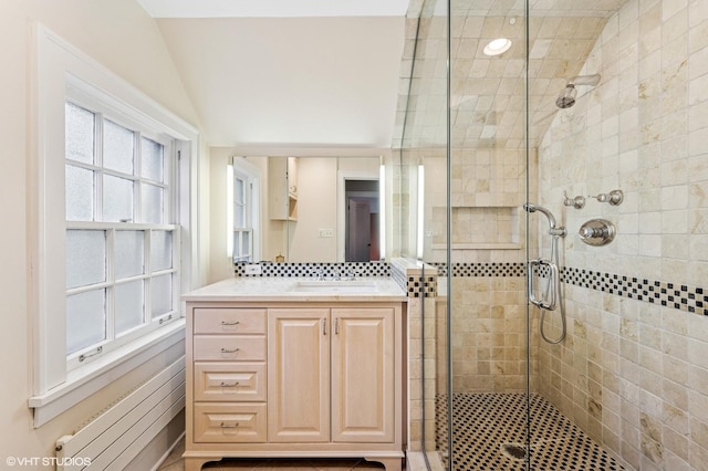 350 Elder Ln, Winnetka, IL 60093 - bathroom featuring a shower stall, vanity, lofted ceiling, and backsplash