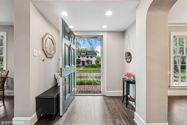 350 Elder Ln, Winnetka, IL 60093 - entryway featuring dark wood-style flooring, plenty of natural light, arched walkways, recessed lighting, and ornamental molding
