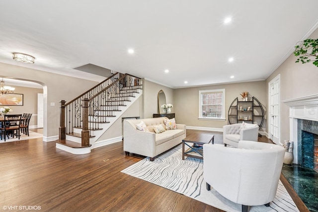 350 Elder Ln, Winnetka, IL 60093 - living area featuring arched walkways, stairs, wood finished floors, baseboards, and recessed lighting