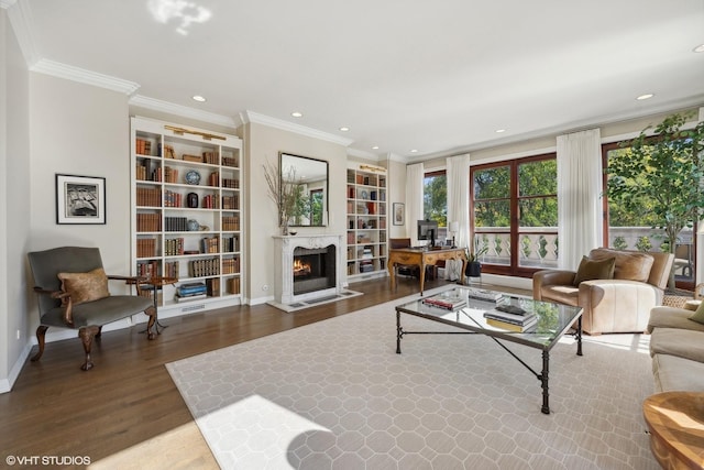 2122 N Hudson Ave, Chicago, IL 60614 - living room with wood finished floors, a lit fireplace, crown molding, built in shelves, and recessed lighting