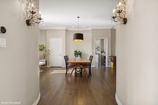 2122 N Hudson Ave, Chicago, IL 60614 - dining area featuring crown molding, dark wood-style flooring, baseboards, recessed lighting, and a chandelier