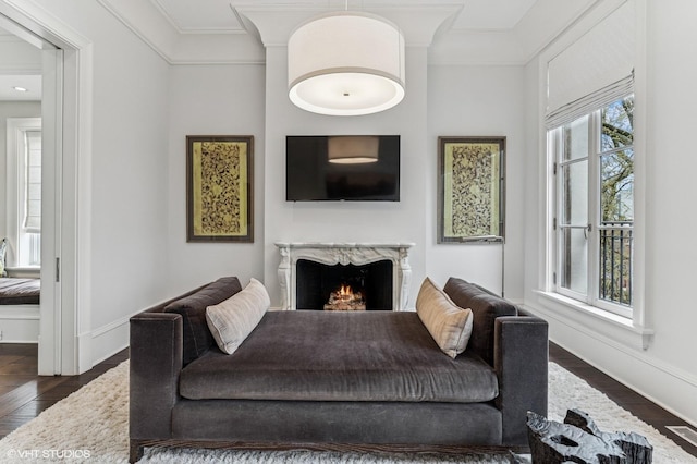 542 W Dickens St, Chicago, IL 60614 - living room featuring baseboards, a fireplace, ornamental molding, and dark wood finished floors