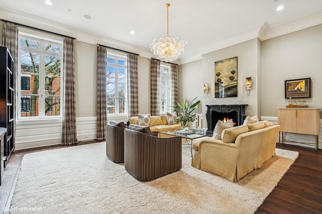 542 W Dickens St, Chicago, IL 60614 - living area featuring crown molding, dark wood-type flooring, a high end fireplace, a chandelier, and recessed lighting