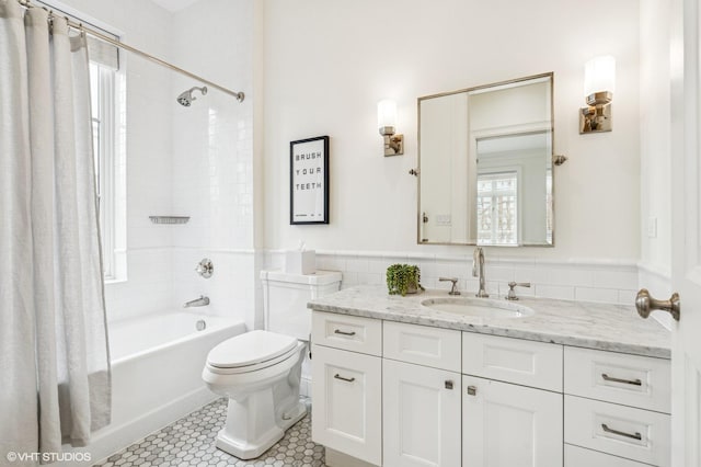 542 W Dickens St, Chicago, IL 60614 - full bathroom with toilet, shower / bath combination with curtain, vanity, tile patterned floors, and wainscoting