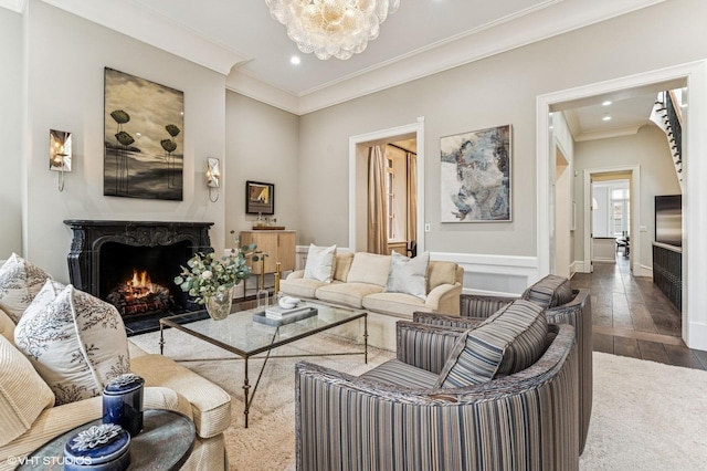 542 W Dickens St, Chicago, IL 60614 - living room featuring dark wood finished floors, recessed lighting, crown molding, a premium fireplace, and a chandelier