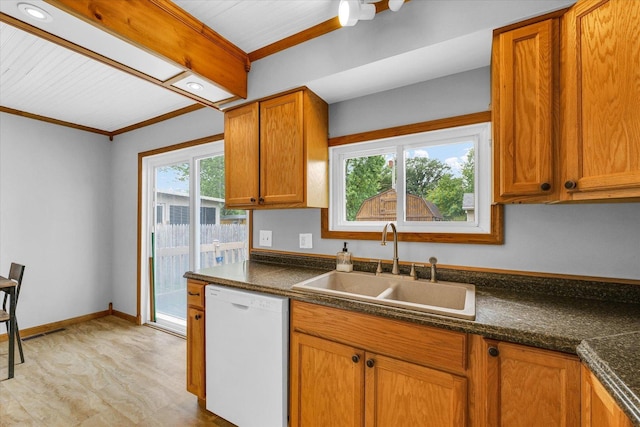 404 S Neal St, Camargo, IL 61919 - kitchen with white dishwasher, a sink, dark countertops, brown cabinetry, and crown molding