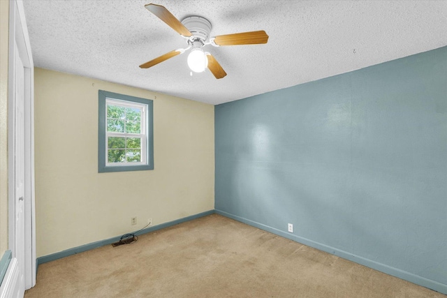 404 S Neal St, Camargo, IL 61919 - empty room with carpet, baseboards, a ceiling fan, and a textured ceiling