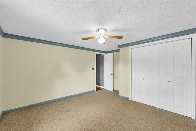 404 S Neal St, Camargo, IL 61919 - unfurnished bedroom with carpet, a closet, baseboards, ceiling fan, and a textured ceiling