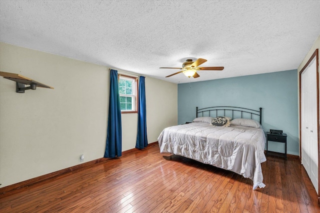404 S Neal St, Camargo, IL 61919 - bedroom featuring hardwood / wood-style floors, a textured ceiling, a ceiling fan, and baseboards