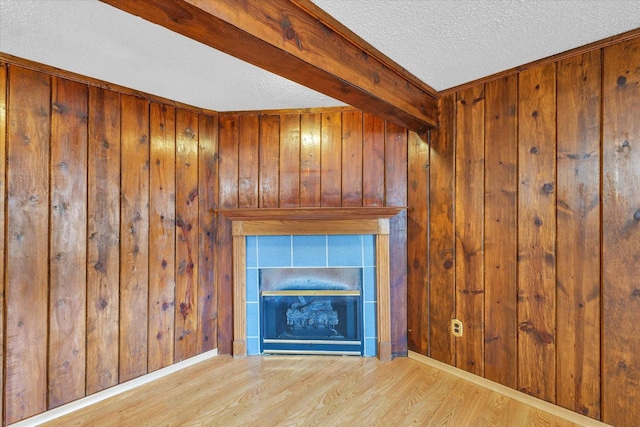 404 S Neal St, Camargo, IL 61919 - detailed view of a textured ceiling, wood finished floors, wooden walls, and baseboards