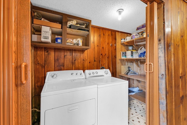 404 S Neal St, Camargo, IL 61919 - laundry area featuring washing machine and dryer, wood walls, a textured ceiling, and light flooring