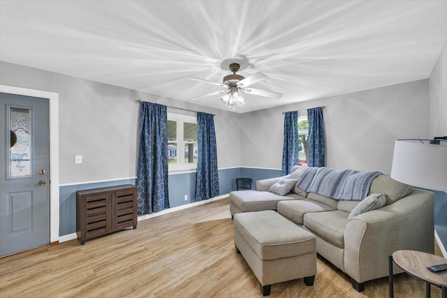 404 S Neal St, Camargo, IL 61919 - living room with plenty of natural light, light wood-type flooring, a ceiling fan, and baseboards