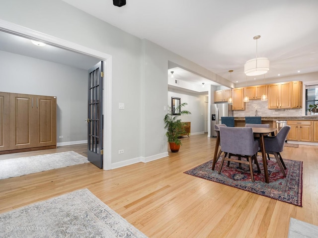 2636 N Fairfield Ave Unit 1N, Chicago, IL 60647 - dining space with light wood-style floors and baseboards