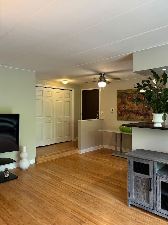 13515 Leclaire Ave Unit 55, Crestwood, IL 60418 - unfurnished living room featuring ceiling fan, light wood-type flooring, and baseboards