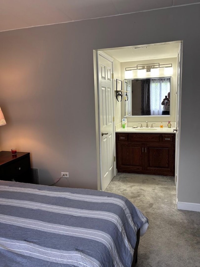 13515 Leclaire Ave Unit 55, Crestwood, IL 60418 - bedroom featuring a sink, light colored carpet, ensuite bath, and baseboards