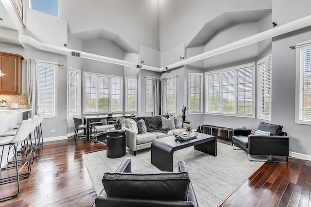 1935 S State St Unit 4, Chicago, IL 60616 - living room with dark wood-type flooring, baseboards, healthy amount of natural light, and a towering ceiling