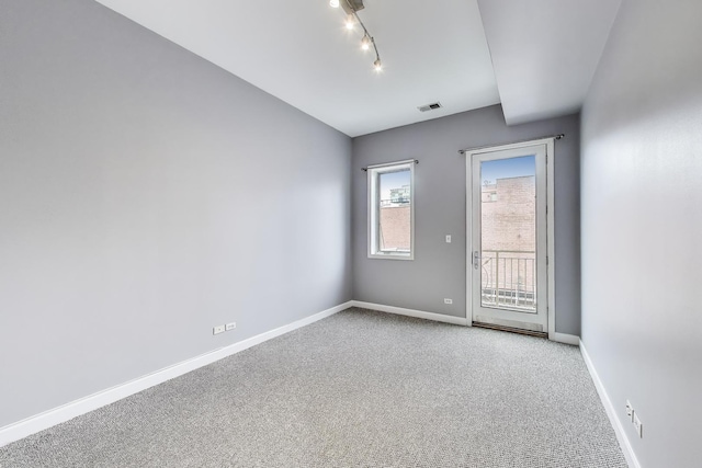 1935 S State St Unit 4, Chicago, IL 60616 - unfurnished room with carpet flooring, baseboards, and track lighting
