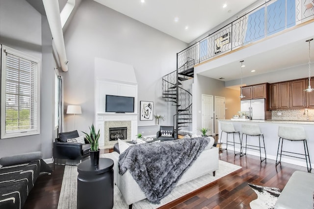1935 S State St Unit 4, Chicago, IL 60616 - living room with a towering ceiling, stairs, dark wood-type flooring, a glass covered fireplace, and recessed lighting