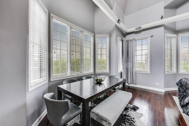1935 S State St Unit 4, Chicago, IL 60616 - dining area featuring baseboards, healthy amount of natural light, dark wood-type flooring, and a high ceiling