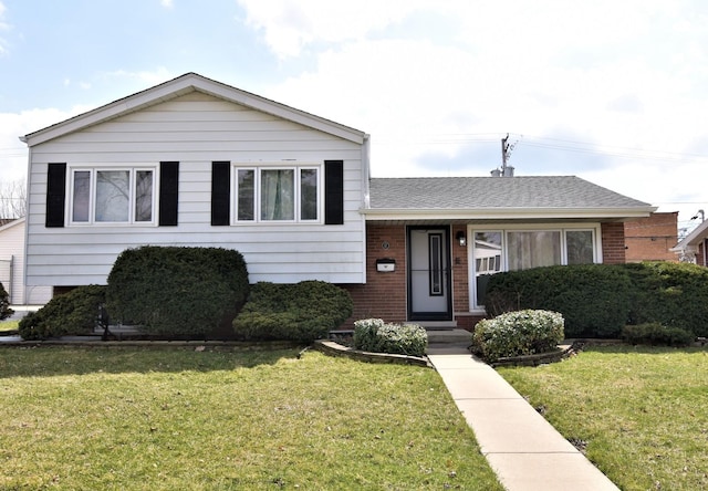 17 E Central Ave, Lombard, IL 60148 - tri-level home featuring brick siding, a front lawn, and roof with shingles