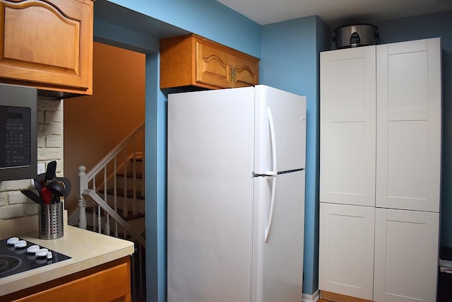17 E Central Ave, Lombard, IL 60148 - kitchen featuring freestanding refrigerator, black electric stovetop, and light countertops