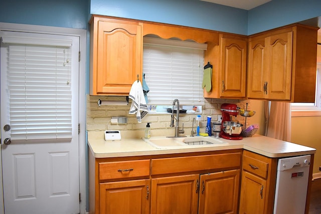 17 E Central Ave, Lombard, IL 60148 - kitchen with white dishwasher, a sink, light countertops, decorative backsplash, and brown cabinets