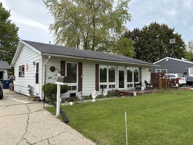 1937 Western Ave, Waukegan, IL 60087 - view of front facade featuring a front lawn, a shingled roof, and a chimney