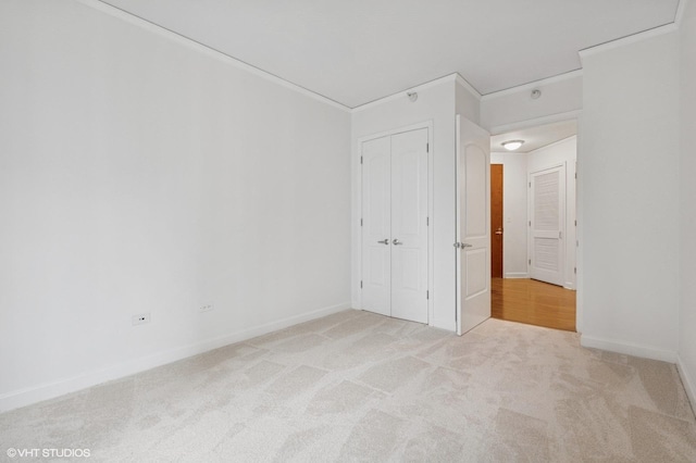 420 E Waterside Dr Unit 1103, Chicago, IL 60601 - unfurnished bedroom featuring light carpet, a closet, and baseboards