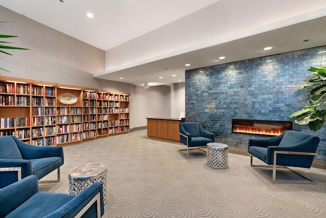 420 E Waterside Dr Unit 1103, Chicago, IL 60601 - living area with light carpet, a tile fireplace, bookshelves, recessed lighting, and baseboards