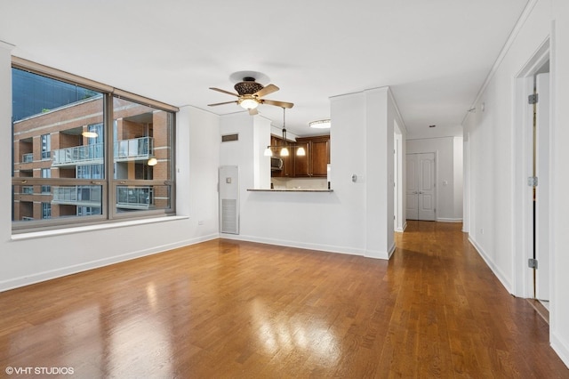 420 E Waterside Dr Unit 1103, Chicago, IL 60601 - unfurnished living room featuring a ceiling fan, wood finished floors, and baseboards