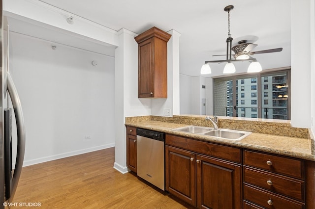 420 E Waterside Dr Unit 1103, Chicago, IL 60601 - kitchen featuring stainless steel dishwasher, a sink, a ceiling fan, light wood-style flooring, and baseboards