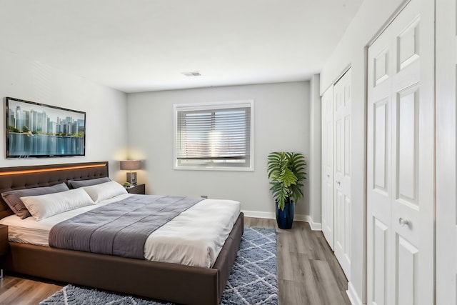 501 Mchenry Rd Unit 3B, Wheeling, IL 60090 - bedroom featuring wood finished floors and baseboards