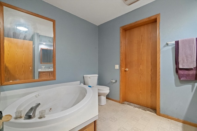26630 W Il Route 134, Ingleside, IL 60041 - full bath with tile patterned floors, toilet, a jetted tub, and baseboards