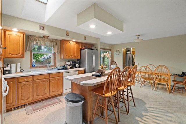 26630 W Il Route 134, Ingleside, IL 60041 - kitchen featuring freestanding refrigerator, dishwasher, a sink, light flooring, and light countertops