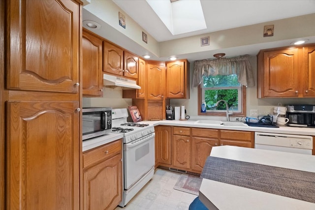 26630 W Il Route 134, Ingleside, IL 60041 - kitchen with a sink, white appliances, under cabinet range hood, light countertops, and recessed lighting