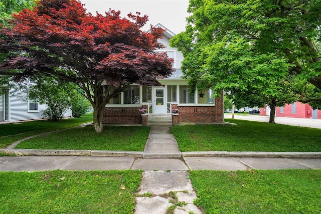 106 W Boundary St, Stanford, IL 61774 - obstructed view of property featuring brick siding and a front lawn