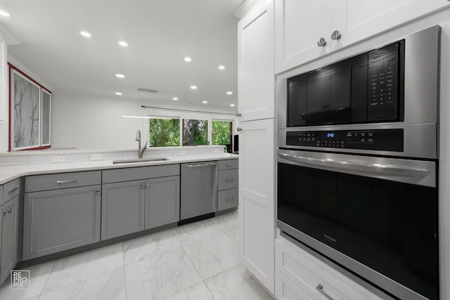 11210 Sycamore Ln Unit 61D, Palos Hills, IL 60465 - kitchen featuring stainless steel dishwasher, a sink, gray cabinetry, light marble finish floors, and recessed lighting