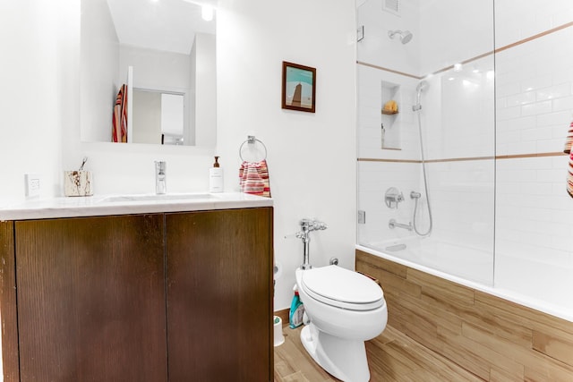 1325 N State Pkwy Unit 17C, Chicago, IL 60610 - full bathroom with tiled shower / bath, vanity, toilet, and wood finished floors