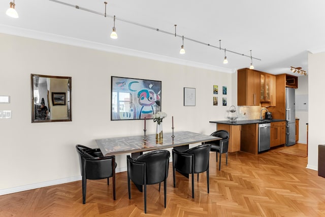 1325 N State Pkwy Unit 17C, Chicago, IL 60610 - dining space featuring crown molding, baseboards, and track lighting