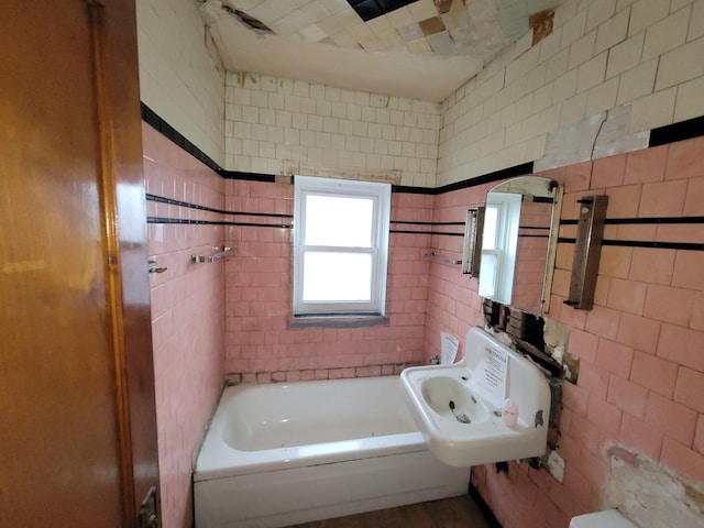 7118 S Morgan St, Chicago, IL 60621 - bathroom with tile walls, a sink, and a tub