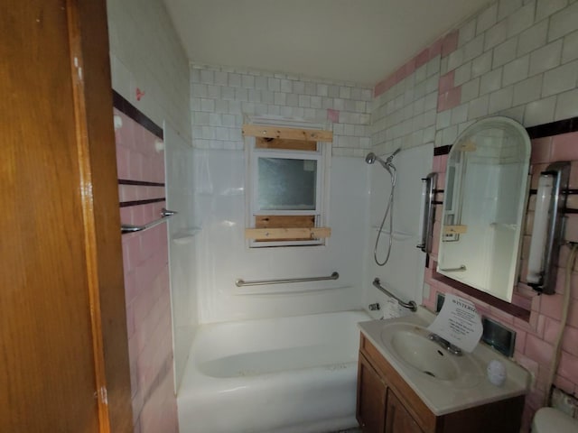 7118 S Morgan St, Chicago, IL 60621 - bathroom featuring vanity, shower / bathtub combination, and tile walls