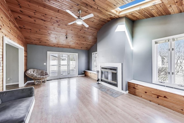 6S009 Steeple Run Dr, Naperville, IL 60540 - unfurnished living room with a skylight, vaulted ceiling, a ceiling fan, healthy amount of natural light, and wooden ceiling