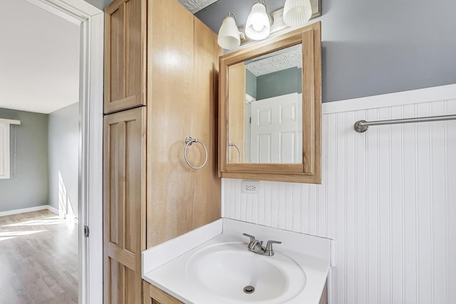 6S009 Steeple Run Dr, Naperville, IL 60540 - bathroom featuring wood finished floors and vanity