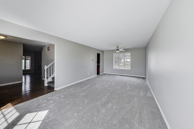 6S009 Steeple Run Dr, Naperville, IL 60540 - spare room featuring carpet flooring, stairs, baseboards, and a ceiling fan