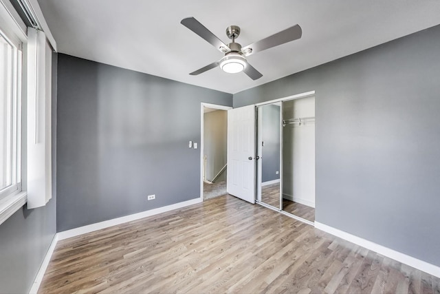 6S009 Steeple Run Dr, Naperville, IL 60540 - unfurnished bedroom with wood finished floors, baseboards, a closet, and a ceiling fan